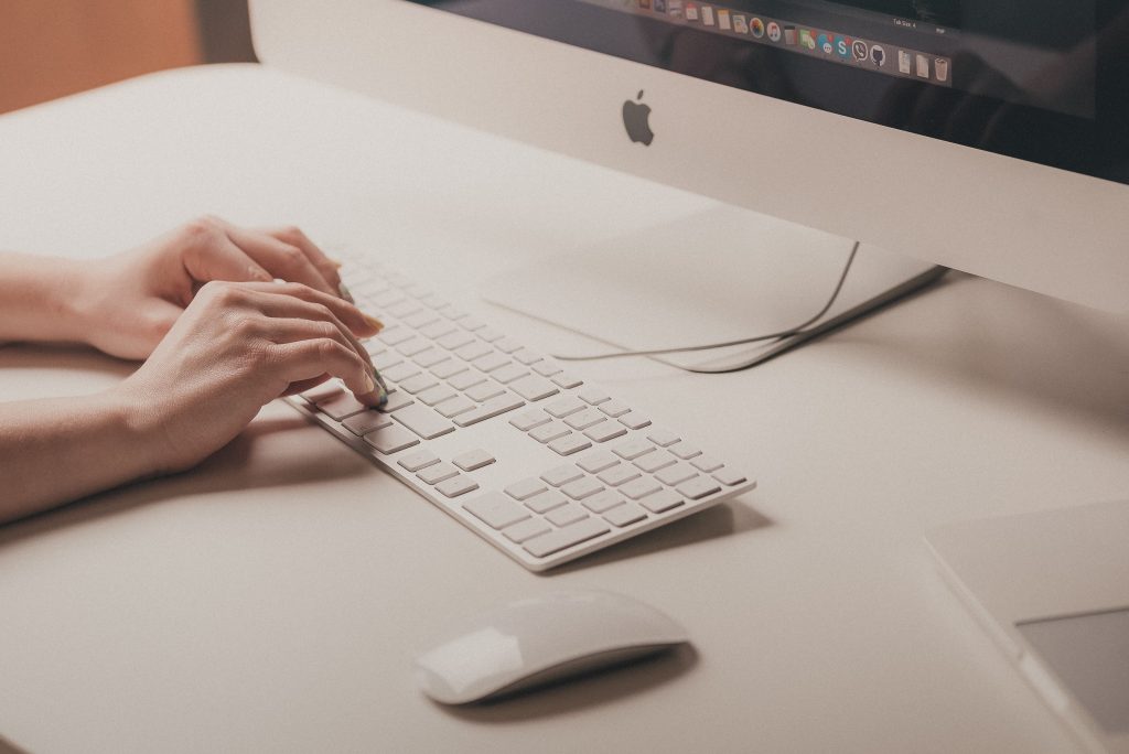 woman writing mail on keyboard