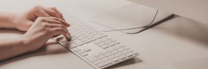 woman writing mail on keyboard